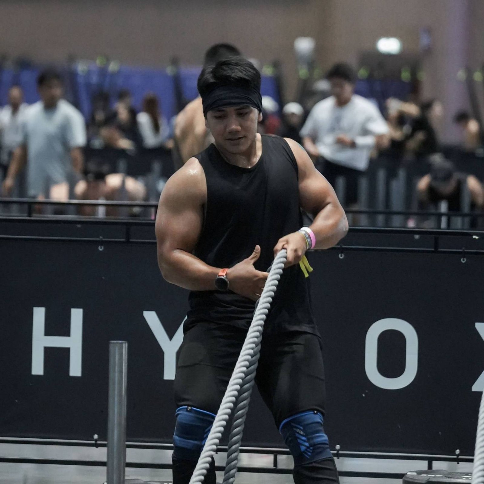 Faris pulling a rope during a HYROX sled pull